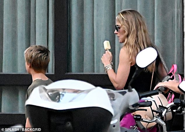 The Spanish-born star, 47, who is visiting her family in her home country, licked an ice cream as she took in the sights of her genetically blessed family