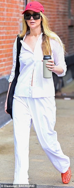 Jennifer Lawrence running errands in New York City in June wearing a white tailored set