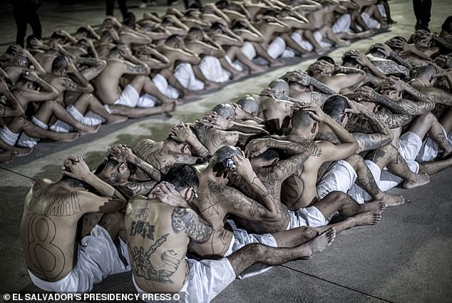 Inside images show topless and heavily tattooed inmates under the watchful eye of heavily armed guards at the facility that is a key part of a concerted effort to reduce El Salvador's murder rate.