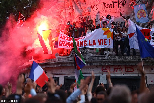 People gather to protest against the far-right French Rassemblement National party after partial results in the first round of elections, in Paris, France, on June 30