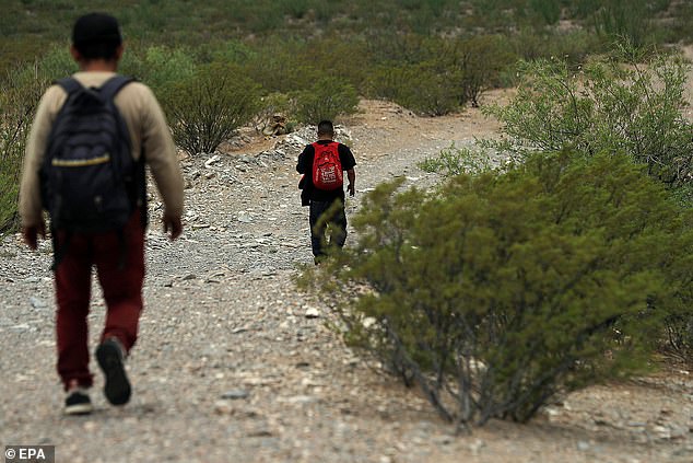 Migrants walk through the Chihuahuan Desert in Juarez, Mexico, on July 5, 2024