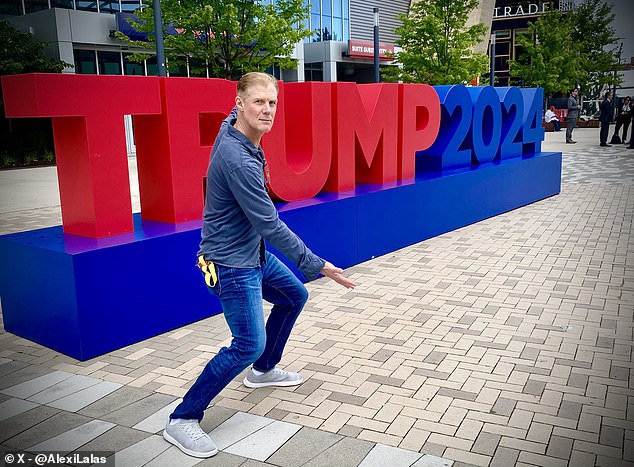 Alexi Lalas is seen next to a 'TRUMP 2024' sign in Milwaukee during the ongoing RNC