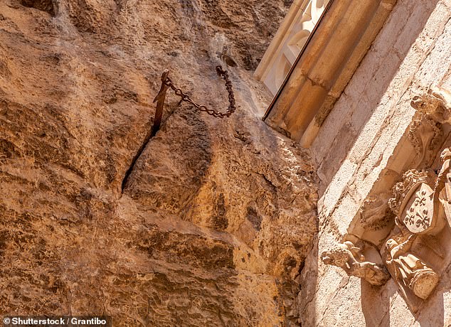 The famous Durandal sword (pictured) is believed to have been stolen from the southern village of Rocamadour, despite being found wedged and chained to the stone 32 feet up