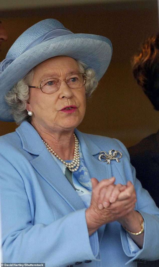 Essie's Ballet Slippers nail polish was 'the only colour Her Majesty would wear'. Above: The Queen with her nails on display at Newbury in 2005