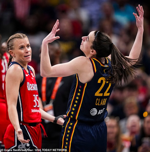 Clark (22) imitates Washington Mystics guard Julie Vanloo during Wednesday's matinee