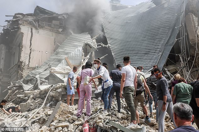 Rescue workers work at the Ohmatdyt Children's Hospital which was damaged in a Russian missile attack, during the Russian attack on Ukraine, in Kiev, Ukraine, July 8, 2024