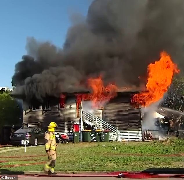 Emergency services rushed to the two-storey house on Chandler Street in Garbutt, Townsville, after residents reported seeing smoke around 3pm on Friday (the house fire is pictured)