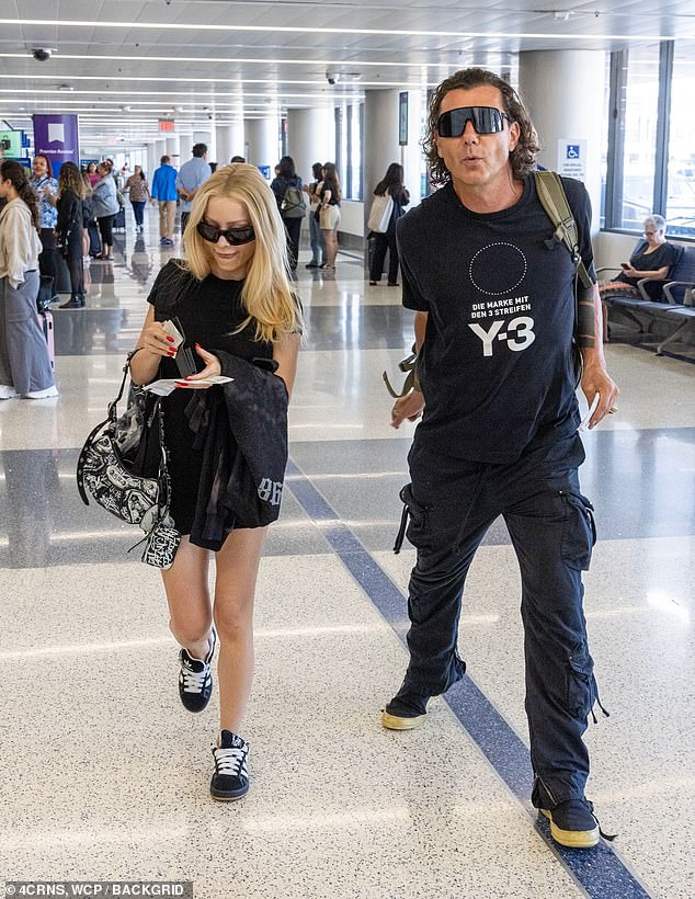 Gavin Rossdale and his girlfriend Xhoana X coordinated in bold sunglasses and all-black attire to catch a flight from LAX Airport in Los Angeles on Wednesday