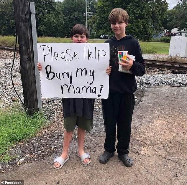 Kayden Ely (left), 11, was forced to stand along the railroad tracks in Lindale for two days to raise money for his mother's funeral