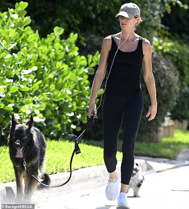 Gisele Bundchen showed off her supermodel qualities as she stepped out for a dog walk in sunny Miami on Thursday