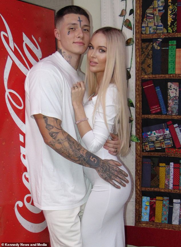 Laura Gehrke, 27, and Joshua Stewart, 21, pose by the prison's Coca-Cola vending machine on their wedding day