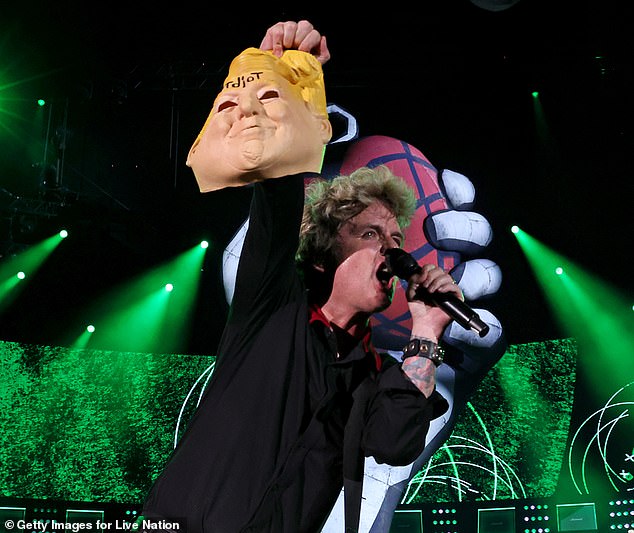 Billie Joe Armstrong was performing at Nationals Park in the nation's capital on Monday when Armstrong pulled out a Trump mask with the word 