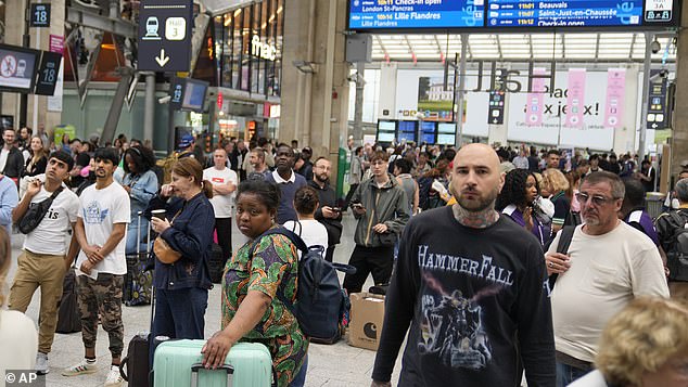 Travelers are stuck at Paris' Gare du Nord train station just hours before the grand opening ceremony