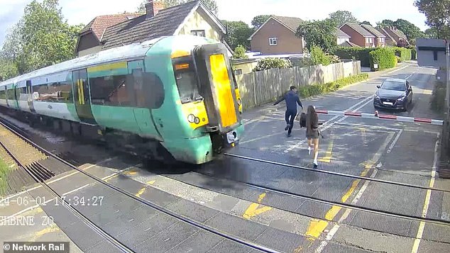 The never-before-seen compilation shows a selection of nerve-wracking near-misses, including two people running across a train track in Kent