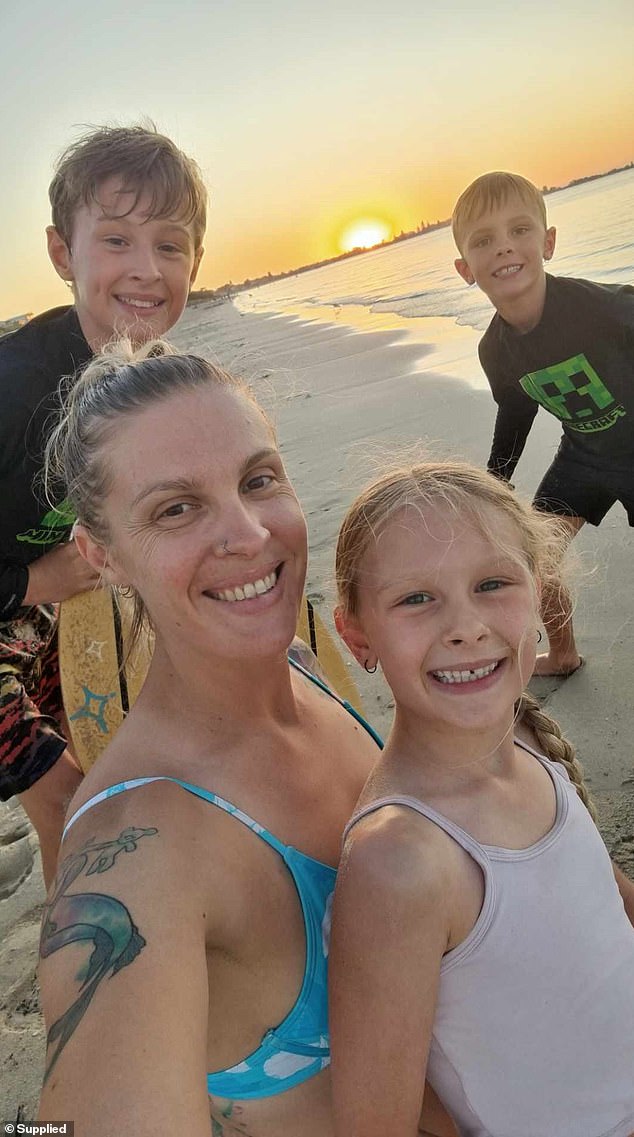 Bec Macnamara (pictured with children Pippa, Jasper and Toby) experienced pain in her knee while training at a CrossFit gym in November last year