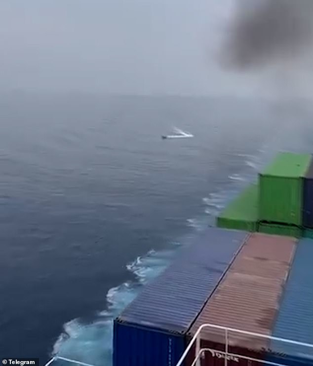 Footage captures the moment what appears to be a Houthis kamikaze drone heads toward a cargo ship in the Red Sea