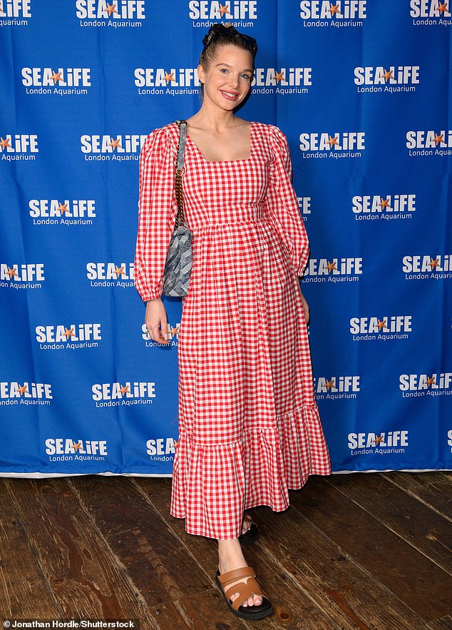 Helen Flanagan dazzled in a red checked dress on Saturday as she attended the opening of Sea Life London Aquarium's rainforest attraction