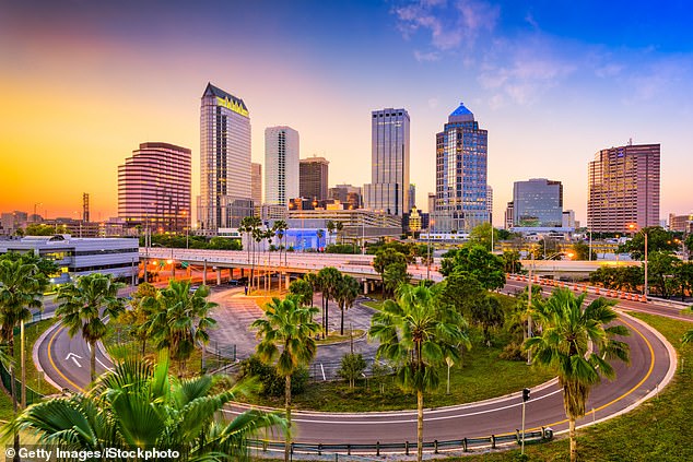 A middle-class lifestyle has become increasingly unattainable in recent years — especially in certain cities across the country. Some metros, like the one around Tampa (pictured here), charge far less, with the Florida city asking just $46,000 to meet the standard