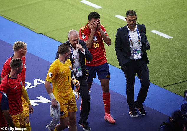 A distraught Rodri leaves the field during half-time after sustaining an injury