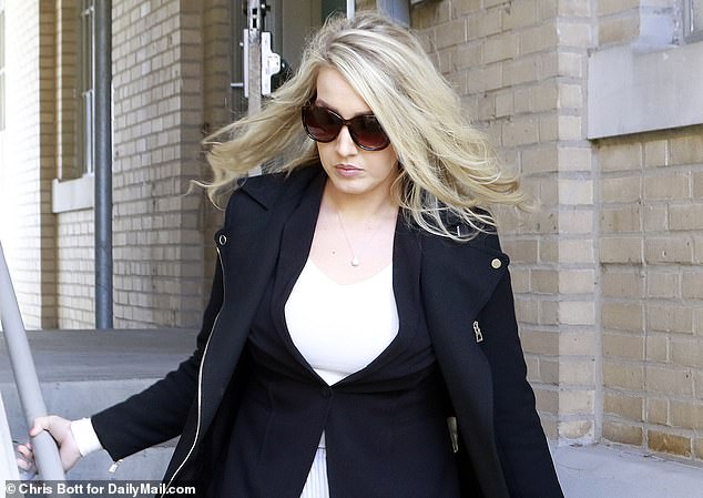Lunden Roberts is photographed leaving court in December 2019 amid her paternity case with Hunter Biden, which she wrote about in her upcoming tell-all. She said Hunter's team wanted her to 'adopt a single parent' Navy