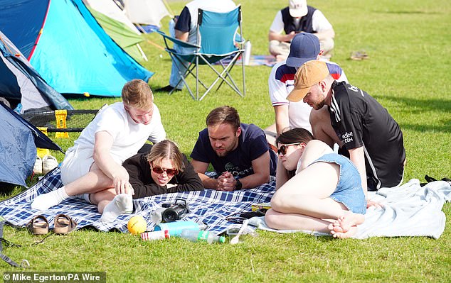 Captivated: A Press Association photographer captured me trying to watch England's European Championship match on a mobile phone