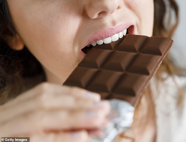 Researchers suspect that antioxidants from cocoa beans, particularly in dark chocolate, could halve the risk of gum disease (Stock photo)