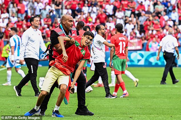 Supporters invaded the pitch after Argentina looked to have scored a late equalizer against Morocco