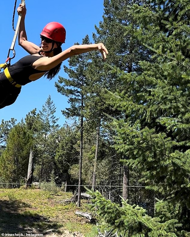 The adventurous city girl posted a photo as she prepared to go ziplining, wearing a black tank top for the forest trek and a red helmet for protection