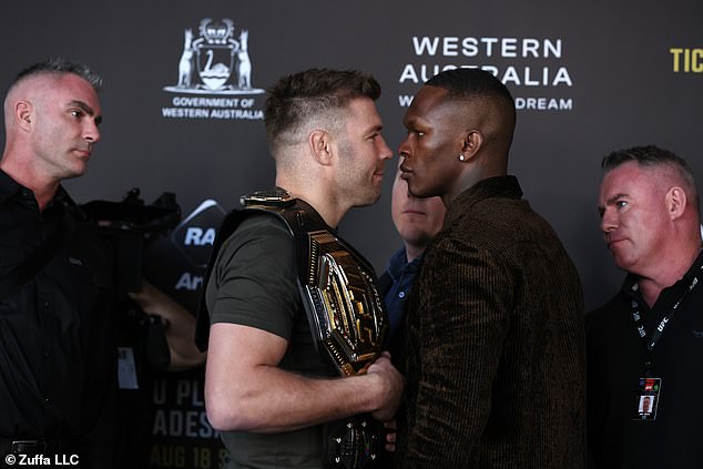 Tensions were high on Tuesday as Israel Adesanya (right) and Dricus Du Plessis faced off for their title fight