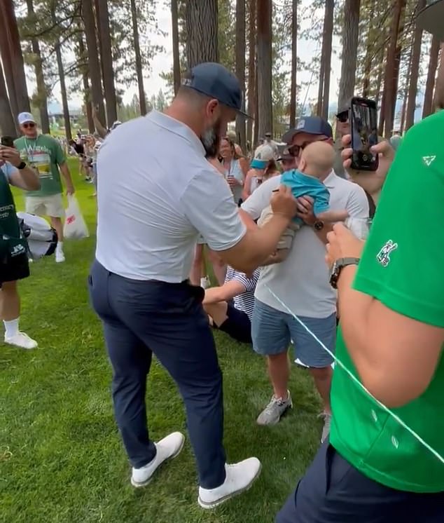 Jason Kelce Signs A Fan's BABY At Celebrity Golf Tournament As Eagles