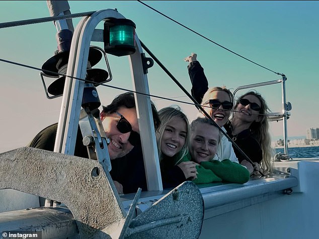 Peter Facinelli (left) reunited with ex-wife Jennie Garth (second from right) for a fun 'Family Day Out' together on a boat with their three daughters Fiona, 17, Lola, 21, and Luca, 27