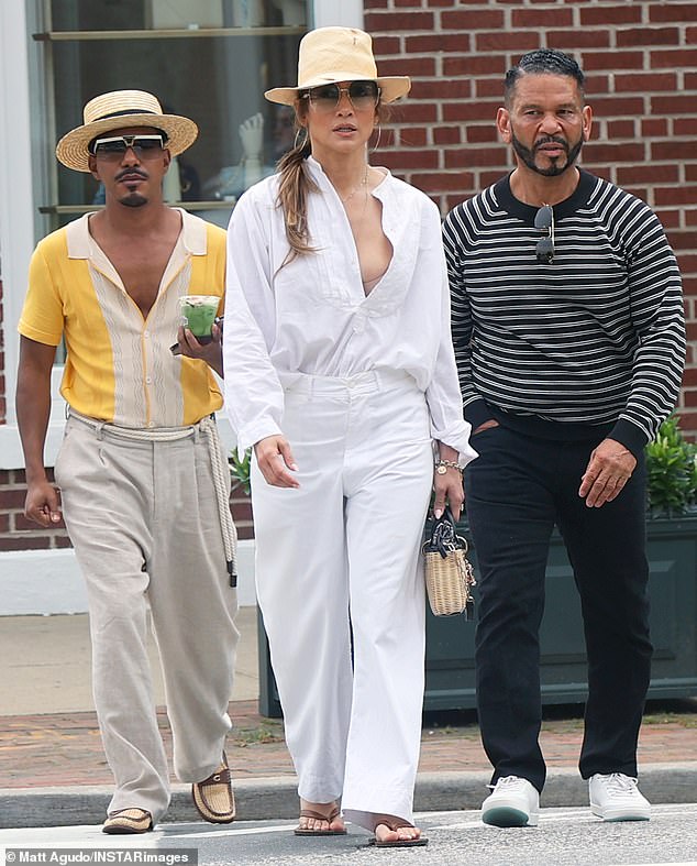 Jennifer Lopez was spotted still wearing her Ben Affleck wedding rings, despite not being photographed with her husband in over a month. She was joined by manager Benny Medina and vocal coach Stevie Mackey for a Friday outing in Bridgehampton, New York