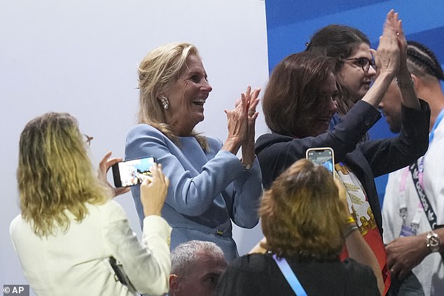 First lady Jill Biden cheers during the opening ceremony