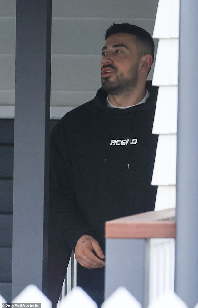 Jono Castano, 33, (pictured) appeared to be struggling as he visited his ex-girlfriend Simone Holtznagel, 31, at her family home in Wollongong on Wednesday