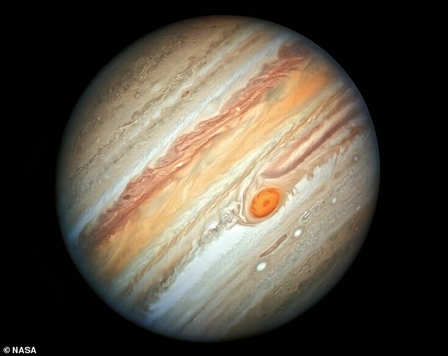 Look at a photograph or artist's illustration of Jupiter and you'll likely see the Great Red Spot - a huge spinning storm in the planet's atmosphere