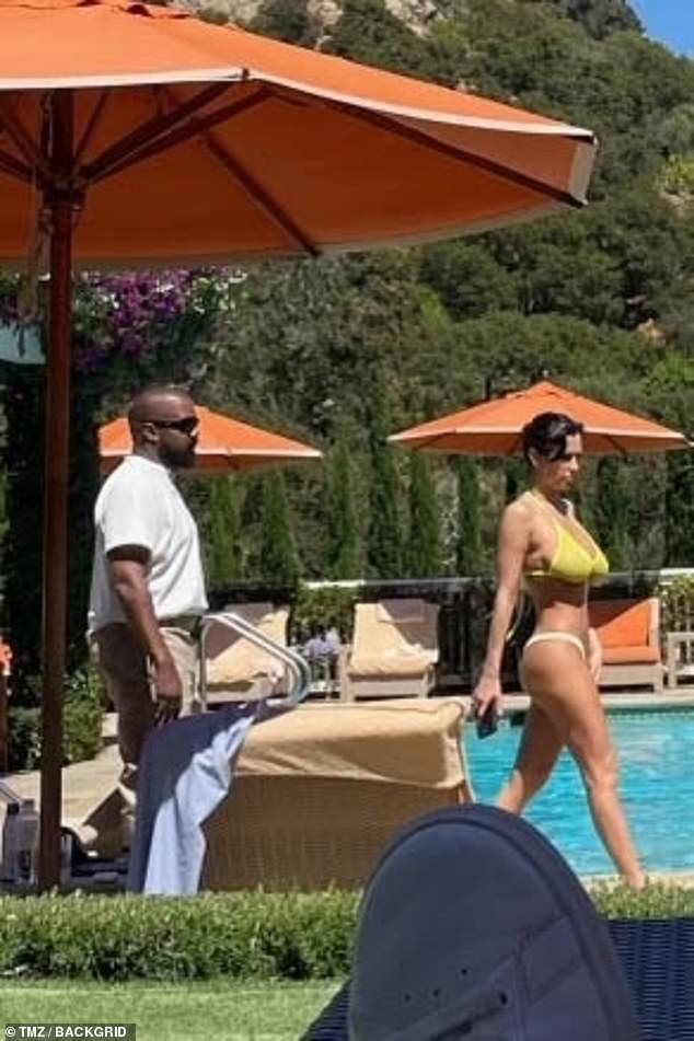 The 47-year-old troubled rapper, 47, and his wife were spotted poolside at the San Ysidro Ranch in Montecito. She wore a skimpy yellow bikini with beige bottoms, while he covered up completely