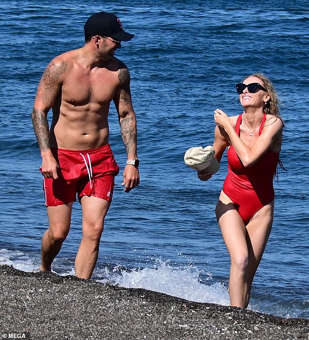 Katie McGlynn, 30, packed on the PDA with her hunky boyfriend Ricky Rayment, 33, as she hit the beach on Friday during their sunny Greek getaway