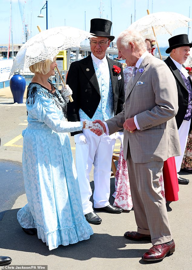 King Charles has undoubtedly spent decades perfecting his handshake as he meets people from all over the world, but today he was complimented for his strong grip