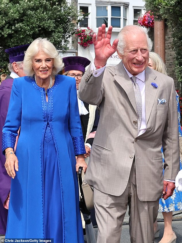 King Charles received an unexpected compliment today from a royal fan who said he had 'rough hands', suggesting he was a 'real worker' during his visit to Guernsey with Queen Camilla (pictured today)