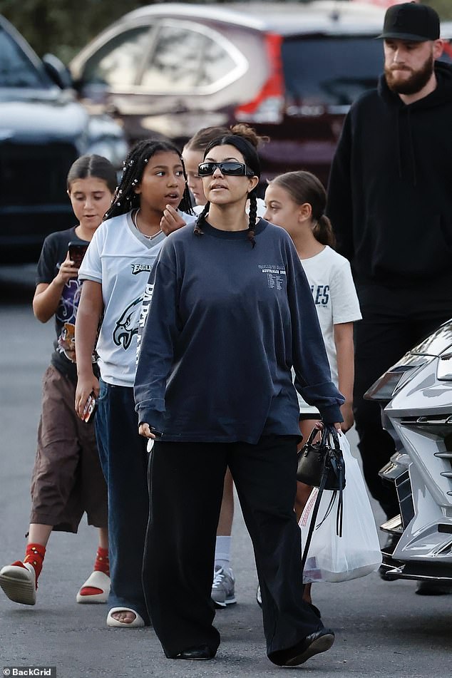 Kourtney Kardashian Barker (M) treated her 12-year-old daughter Penelope Scotland Disick (L), 11-year-old niece North West (2-L) and two of their little friends to dinner at their family favorite sushi restaurant, Shibuya in Calabasas, on Saturday.