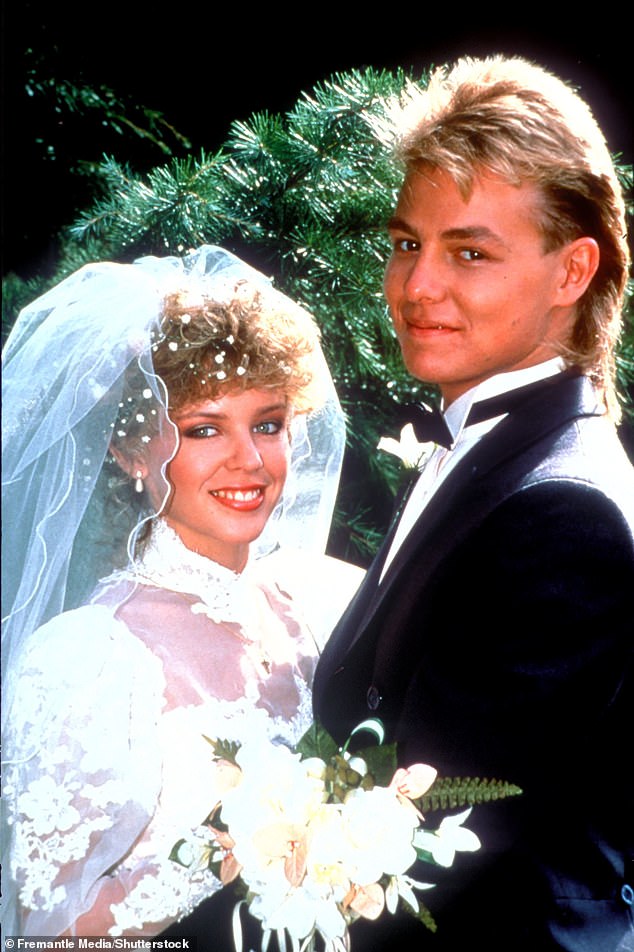 When asked if she had any memories of kissing her on-screen love interest - and former real life boyfriend - Jason Donovan in her beloved Datsun car, Kylie was shy. Pictured as their characters Scott and Charlene in 1988