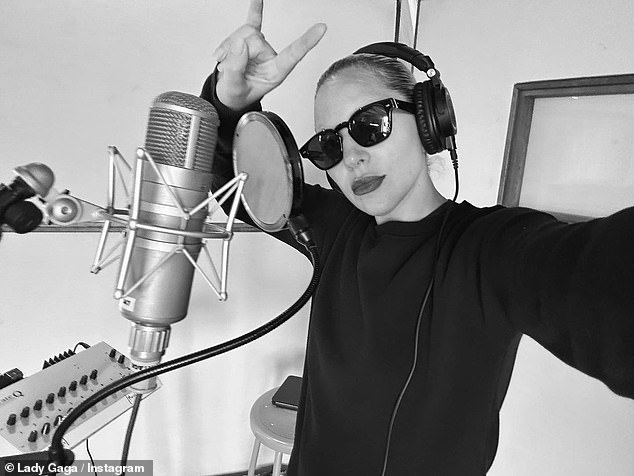 Lady Gaga shared photos of herself posing in the recording studio on Instagram on Thursday