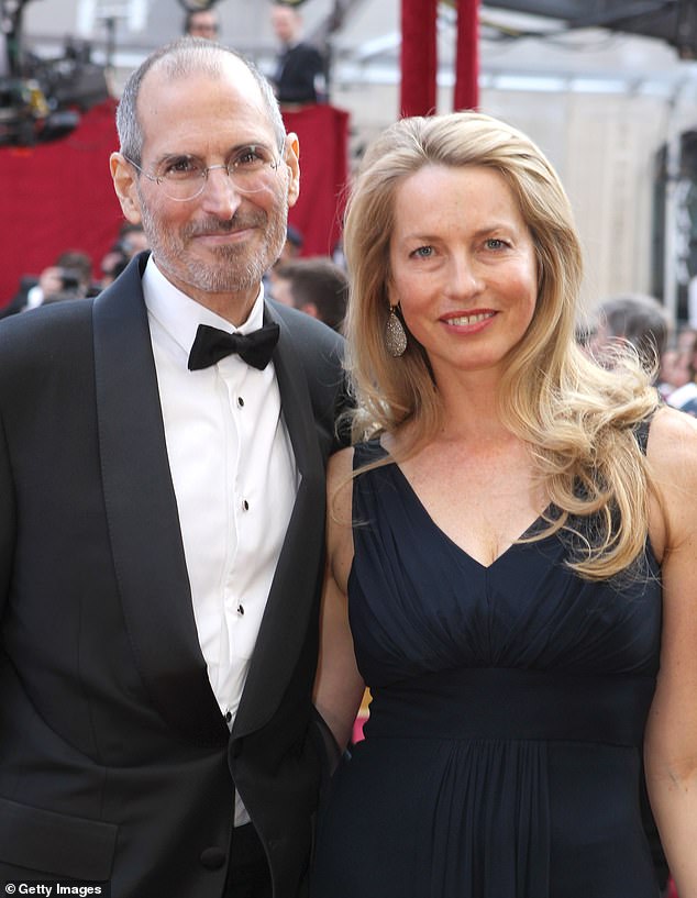 The late tech CEO (left) and his wife Laurene Powell are pictured together in Hollywood in 2010