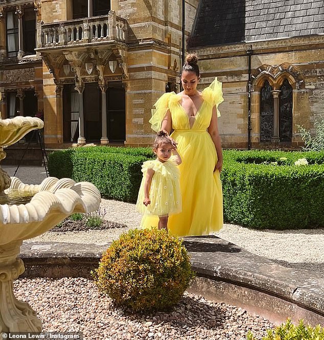 Leona Lewis' one-year-old daughter looked the spitting image of her mother as the couple wore adorable matching yellow tulle princess dresses for a wedding in photos shared on Tuesday