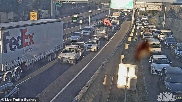 The M5 East in Sydney has been closed towards the city after a car burst into flames, causing traffic chaos during rush hour