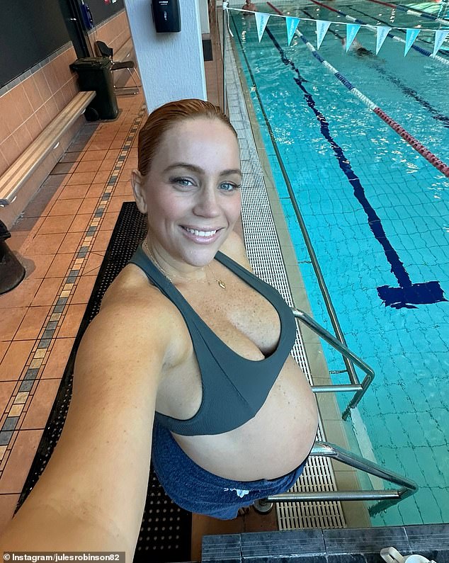 Jules Robinson showed off her huge baby bump during a water aerobics class in Dee Why, Sydney, on Saturday during her final days of pregnancy