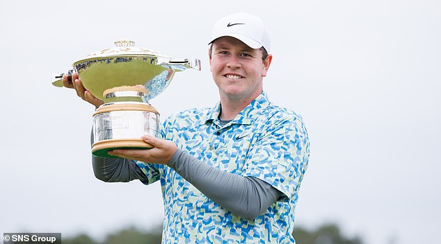 MacIntyre is handed the Scottish Open trophy and is a man in form going into The Open