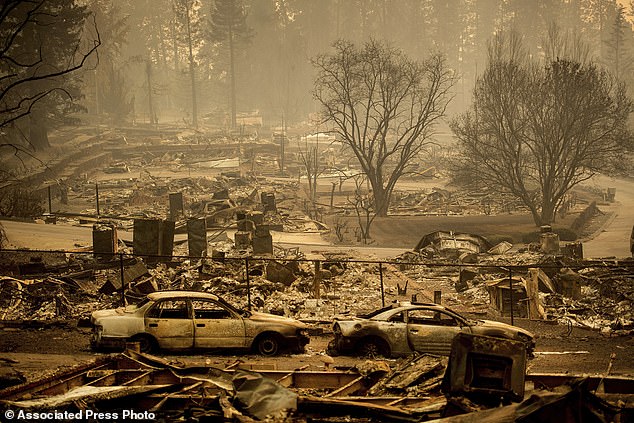 The move signals financial troubles for the insurance giant, which currently covers homes destroyed by wildfires. Homes destroyed by the Camp Fire border a development on Edgewood Lane in Paradise, California, seen here in 2018