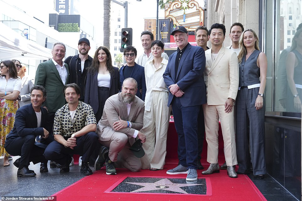 Marvel boss Kevin Feige was supported by a flood of A-listers at his Hollywood Walk of Fame ceremony on Thursday - L-R - Shawn Levy, Louis D'Esposito, Sebastian Stan, Chris Evans, Kathryn Hahn, David Harbour, Ke Huy Quan, Hugh Jackman, Emma Corrin, Feige, Ryan Reynolds, Simu Liu, Chris Pratt and Brie Larson