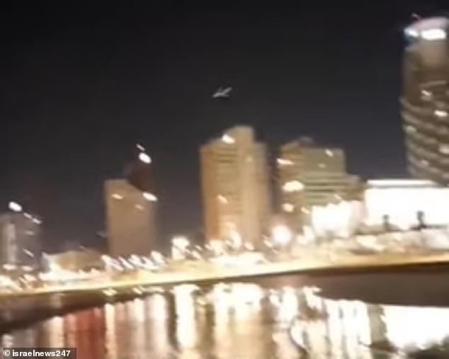 Footage captured the moment a 'Houthi' drone flew low over a beach and headed towards a row of buildings in Tel Aviv, causing an apartment building to explode